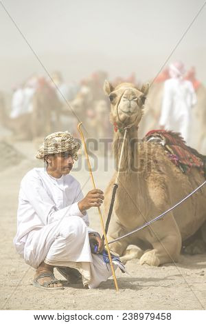 Young Omani Man With His Camel