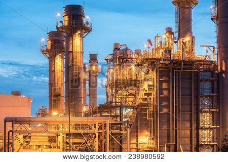 Oil And Gas Refinery Industry Factory At Sunset