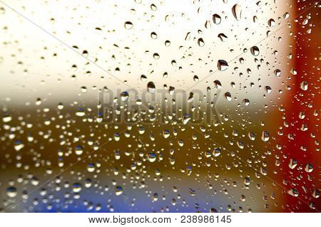Background Raindrops On The Glass With Colored Stripes