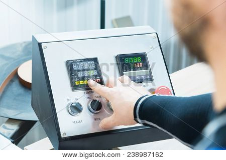 A Close-up Of The Operator The Man Presses The Button On The Control Panel With The Control Devices 