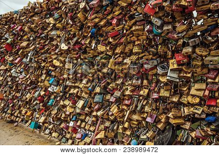 Paris, Northern France - July 12, 2017. Padlocks Fastened To Each Other Celebrating Love On Bridge B