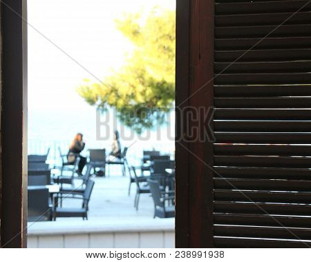 Meeting Of Girlfriends In Cafe. View From Cafe.