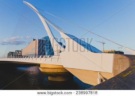 View Of Dublin's Famous Samuel Beckett Bridge Over The River Liffey At Blue Hour