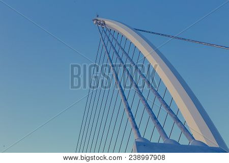 View Of Dublin's Famous Samuel Beckett Bridge Over The River Liffey At Blue Hour