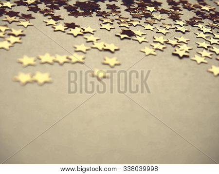 Golden Stars Glitter On Neitral Gray Background