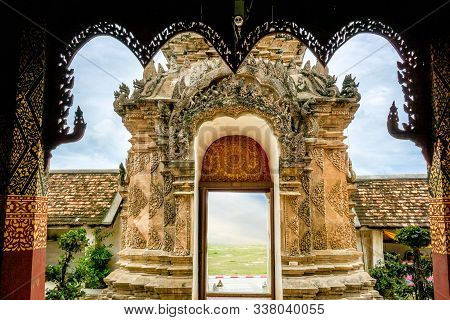 Traditional Thai Lanna Art Gate. Photos View From The Temple Hall Behind The Gate.