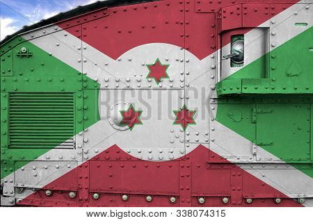 Burundi Flag Depicted On Side Part Of Military Armored Tank Closeup. Army Forces Conceptual Backgrou