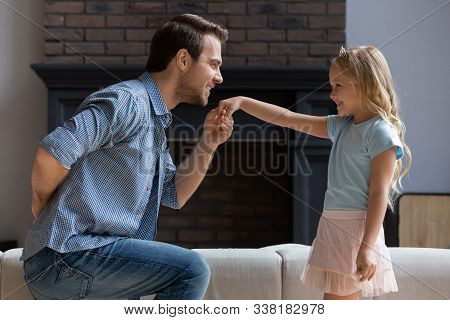 Father Making Curtsey Took Hand Of Daughter For A Kiss