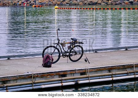 Fishing Gear And Bike On A Pier