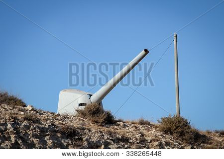 A Discarded Former Ships Cannon Pans On A Rock