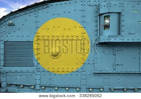 Palau Flag Depicted On Side Part Of Military Armored Tank Closeup. Army Forces Conceptual Background