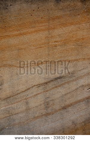 Brown Sandstone Wall Texture Details. Close-up Photo Of Gritty Background. Horizontal Orientation