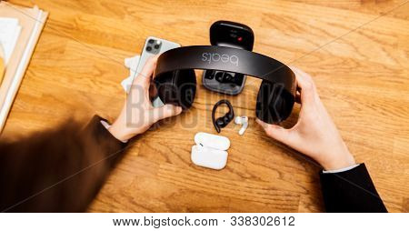 Paris, France - Oct 30, 2019: Overhead View Of Woman Hands Unboxing New Apple Computers Airpods Pro 