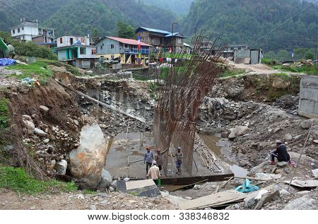 Jiri village, Nepal - April 27, 2019: Construction of a new bridge