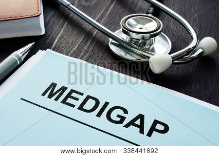 Medigap Supplement Health Insurance Papers And Stethoscope.