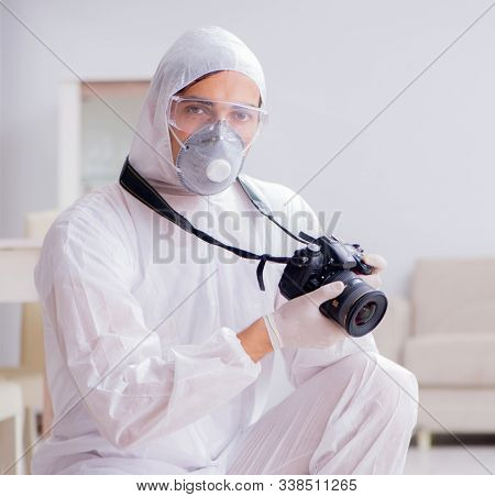Forensic expert at crime scene doing investigation