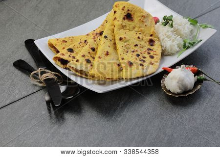 Home Made Gluten Free Chickpea Flour Roti Or Besan Roti Or Chapati Or Bread On A Plate .