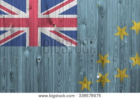 Tuvalu Flag Depicted In Bright Paint Colors On Old Wooden Wall. Textured Banner On Rough Background