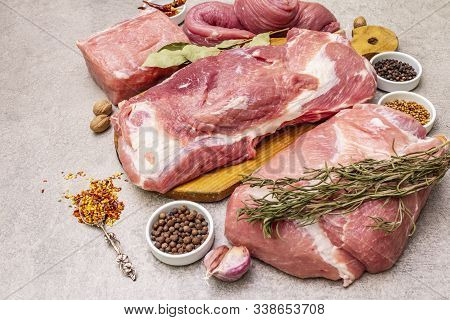 Assorted Various Pork Cuts. Raw Meat With Spices. Tenderloin, Shoulder Blade, Neck, Hind Leg Steak