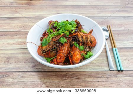 Chongqing Sichuan Spicy Dried Chilli Small Lobsters, With Chopsticks & Spoon. Isolated Food Photogra