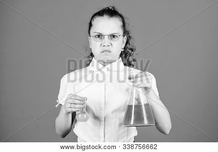 Science Research In Lab. Small School Girl. Education And Knowledge. Small Girl With Testing Flask. 