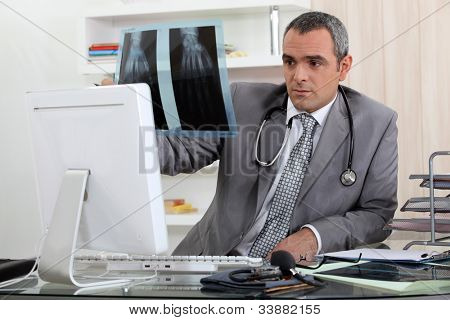 Doctor looking at x