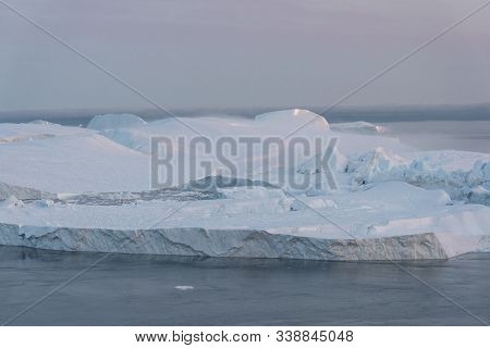 3 Humpback Whale Dive Near Ilulissat Among Icebergs During Pink Midnight Sun. Sunrise And Sunset. Th
