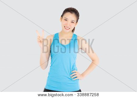 Beautiful Portrait Young Asian Woman In Sport Clothes With Satisfied And Confident Gesture Finger V 