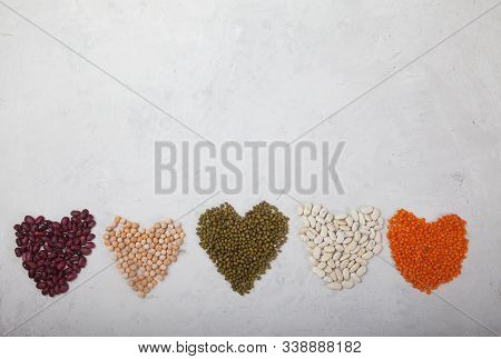 Raw Buckwheat In A Clay Cup On A Blue Wooden Background. Copy Spaes