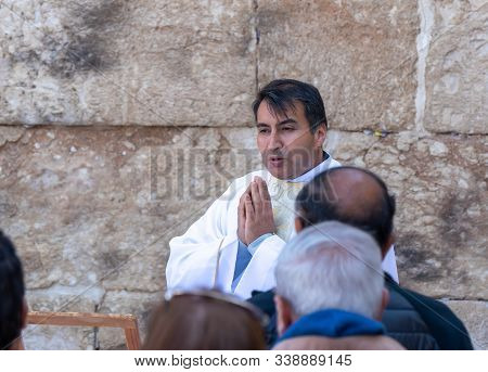 Ramla, Israel, December 07, 2019 : The Priest Makes A Collective Prayer On The Ruins Of The Byzantin