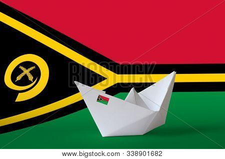 Vanuatu Flag Depicted On Paper Origami Ship Closeup. Handmade Arts Concept