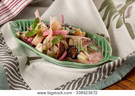 Healty Salad On Green Plate And On A Napkin