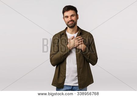 Kindness, Happiness And Friendship Concept. Tender Handsome Man Feeling Touched And Grateful For Kin