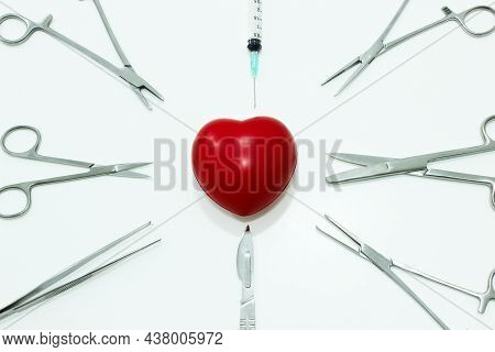 Heart And Surgical Instruments Isolated On The White Background