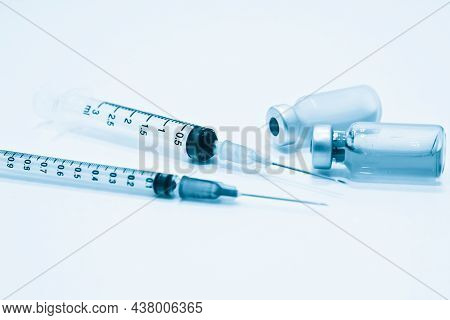 Vial Of Drug,3 Ml And 1 Ml Plastic Syringe With Needle Isolated On The White Background