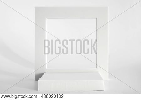 White Podium On The White Background, Simple Geometric Forms. Podium For Product, Cosmetic Presentat