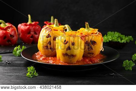 Jack O Lanterns Stuffed Yellow Pepper For Halloween.