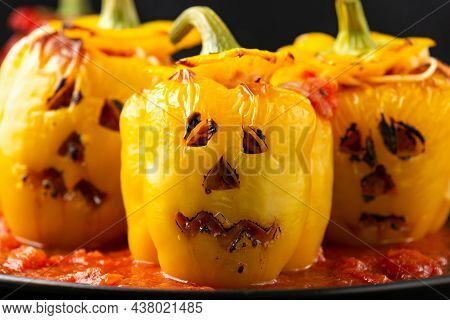 Jack O Lanterns Stuffed Yellow Pepper For Halloween.