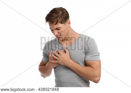 Unhappy Millennial Caucasian Guy Suffering From Heart Pain And Pressing Hands To Chest With Painful 