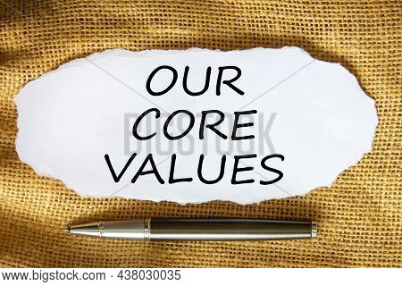 Our Core Values Symbol. Words 'our Core Values' On White Paper. Black Metallic Pen. Beautiful Canvas
