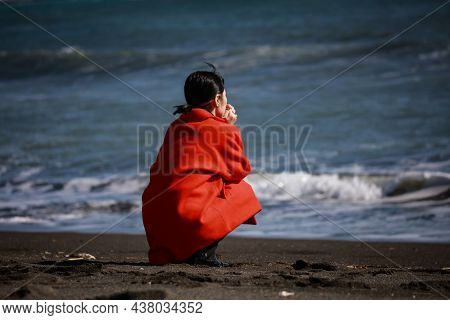 Image Of A Woman Depressed On The Beach