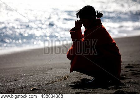 Image Of A Woman Depressed On The Beach