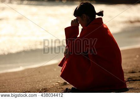 Image Of A Woman Depressed On The Beach
