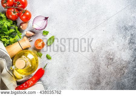 Food Cooking Background. Food Ingredients. Olive Oil, Herbs And Vegeables At Stone Table Top View.