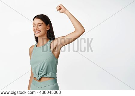 Image Of Happy Fitness Girl Achieve Goal, Raising Hand Up And Smiling, Winning Prize, Finish Marapho