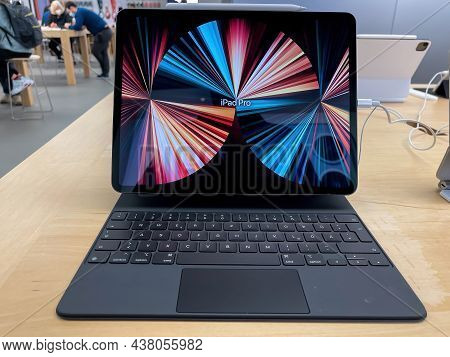 Frankfurt, Germany - October 28th 2021: A German Photographer Visiting An Apple Store, Comparing The