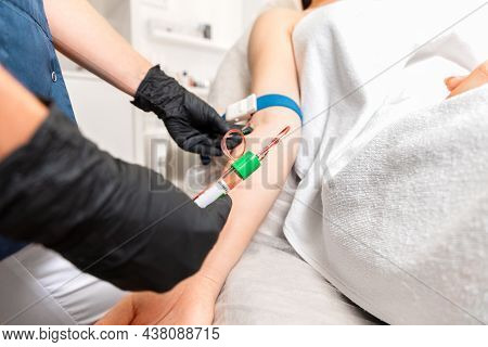 Cosmetology And Health. Beautician Makes Blood Sampling From The Client's Hand For The Plasmolifting