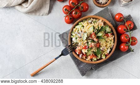 Salad With Bulgur, Tomatoes, Cucumbers And Parsley. Tabouleh Dish. Oriental Cuisine. Copy Space.