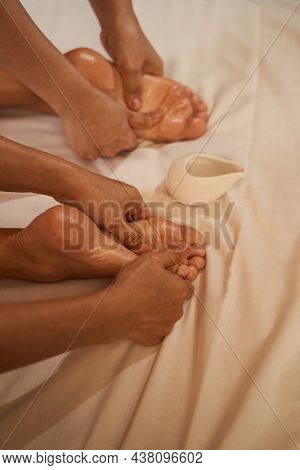 Experienced Reflexologists Giving Their Patient Thai Foot Massage