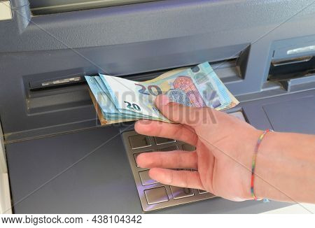 Hand Of Young Man Taking Banknotes From Cash Machine Euro Cash Machine In European City